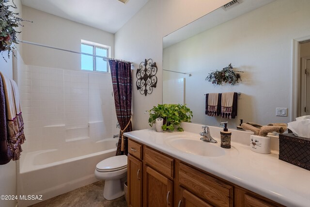 full bathroom with vanity, toilet, and shower / bath combination with curtain