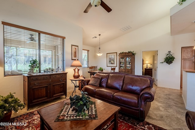 living room featuring ceiling fan and lofted ceiling