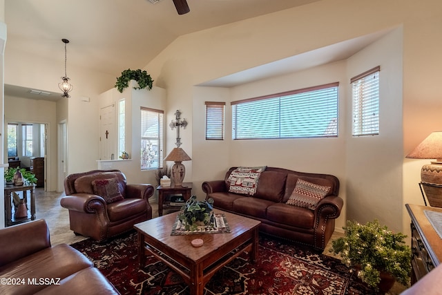 living room with a wealth of natural light and lofted ceiling