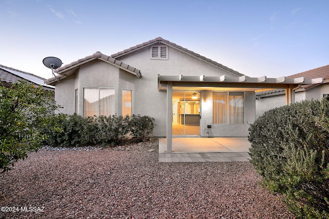 rear view of house featuring a patio