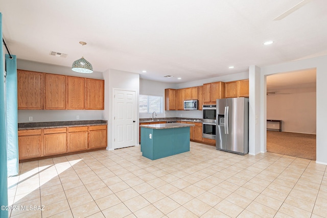 kitchen featuring light tile patterned floors, visible vents, appliances with stainless steel finishes, a center island, and recessed lighting