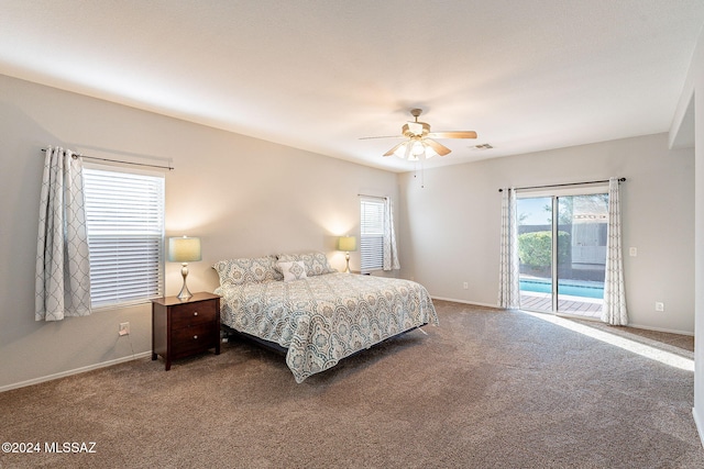 bedroom with access to outside, multiple windows, carpet floors, and a ceiling fan