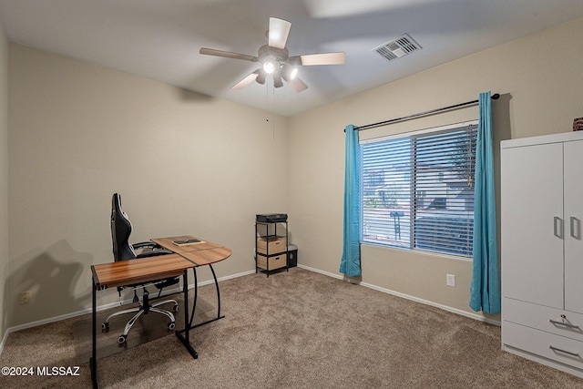 office with carpet, visible vents, ceiling fan, and baseboards