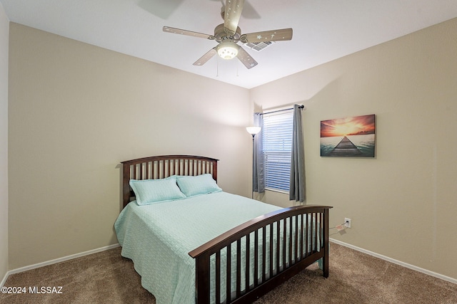 bedroom with carpet flooring, a ceiling fan, and baseboards