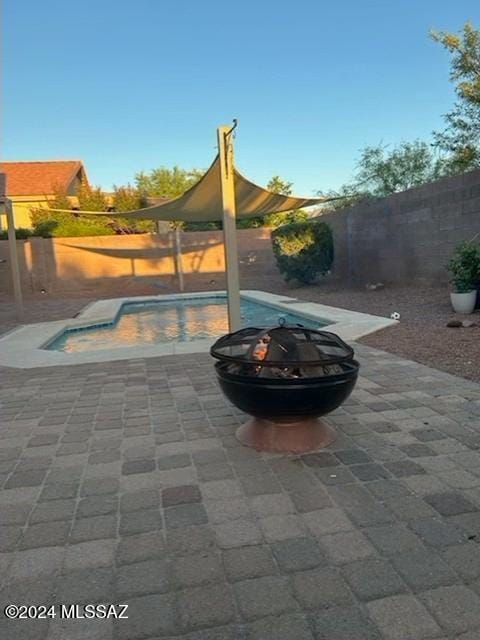 view of patio / terrace with a fenced backyard and a fenced in pool