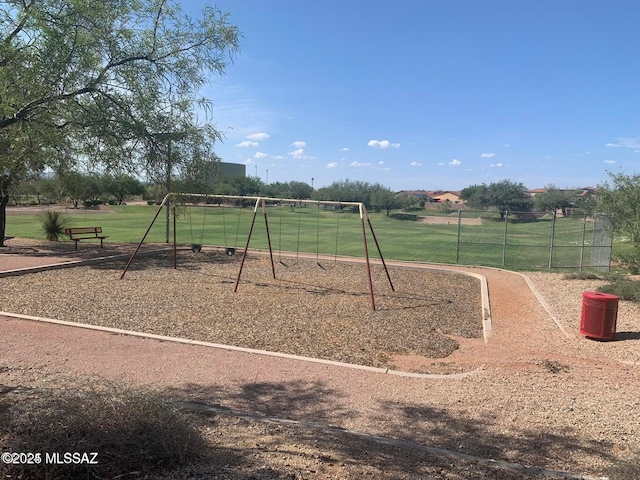 community jungle gym with a lawn