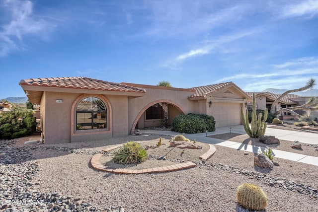 mediterranean / spanish house featuring a garage