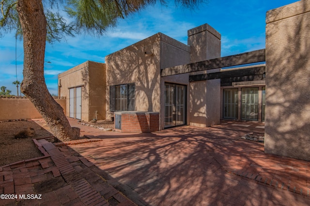 rear view of property featuring a patio