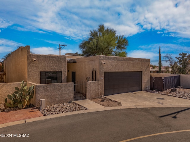 southwest-style home featuring a garage