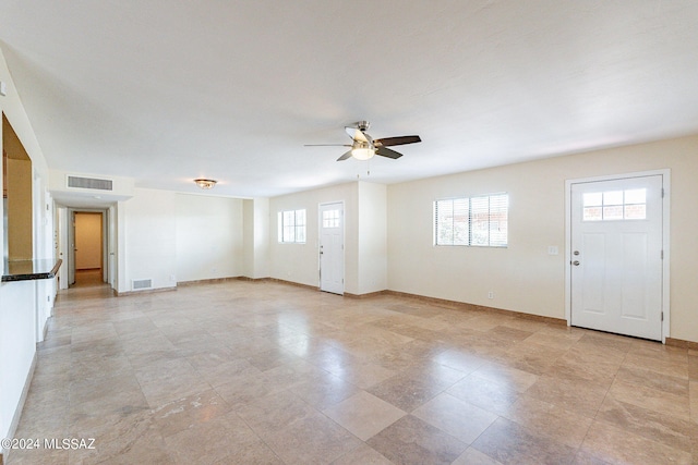 interior space featuring ceiling fan