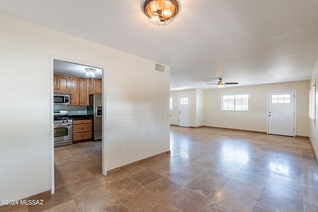 interior space featuring ceiling fan