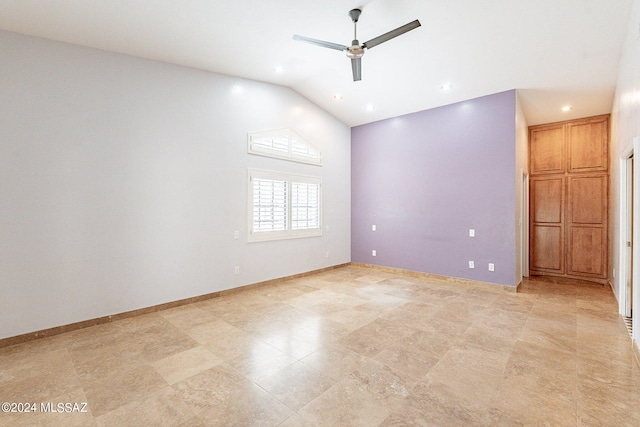 spare room featuring lofted ceiling and ceiling fan