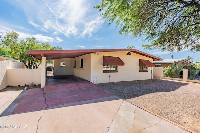 view of front of house with a carport