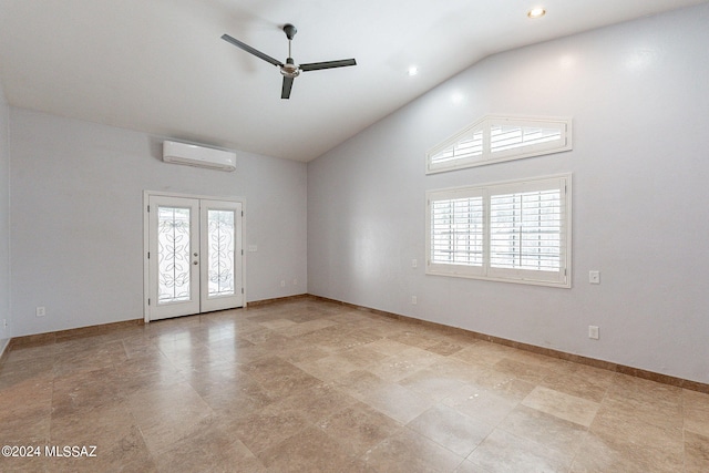 empty room with french doors, ceiling fan, high vaulted ceiling, and a wall mounted AC