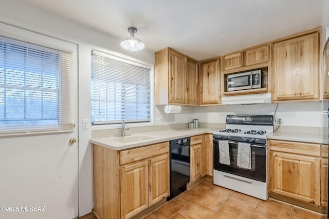 kitchen with range with gas stovetop, light brown cabinets, a sink, dishwasher, and under cabinet range hood