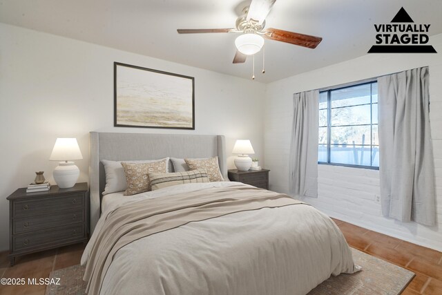 bedroom featuring ceiling fan and wood finished floors