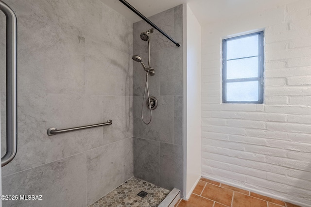 full bath with tile patterned flooring and a shower stall