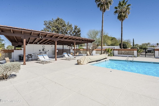 view of pool featuring a patio, fence, and a fenced in pool