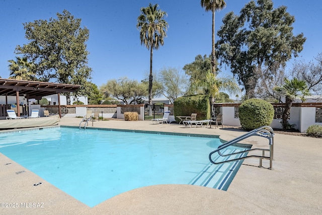 community pool featuring a patio area