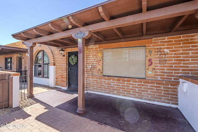 entrance to property with brick siding