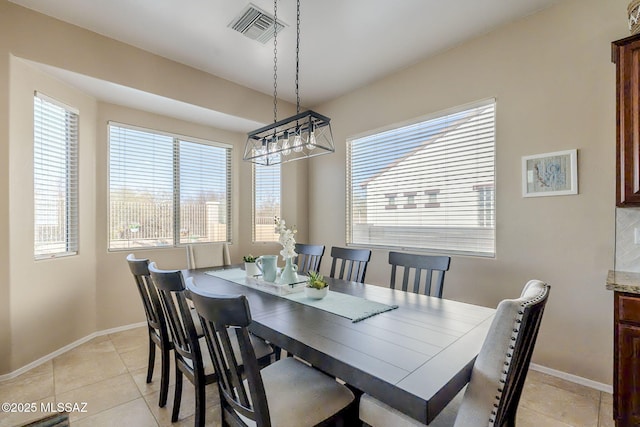 dining room featuring light tile patterned flooring