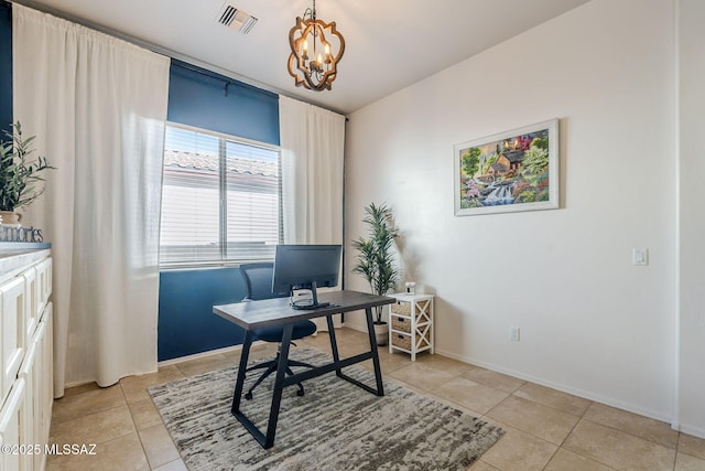 office space with light tile patterned floors and a notable chandelier