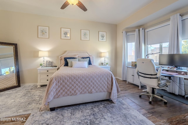 bedroom with ceiling fan and hardwood / wood-style floors