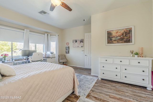 bedroom with ceiling fan and light hardwood / wood-style flooring