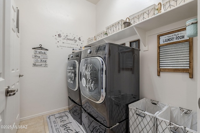 laundry area featuring light tile patterned flooring and separate washer and dryer