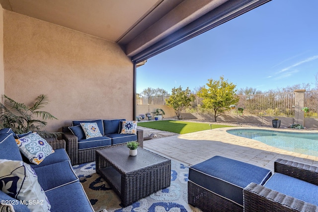 view of patio / terrace featuring outdoor lounge area and a fenced in pool