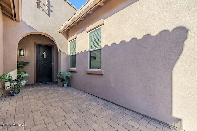 entrance to property with a patio