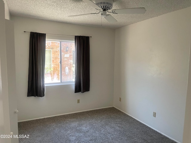 carpeted empty room featuring a textured ceiling and ceiling fan