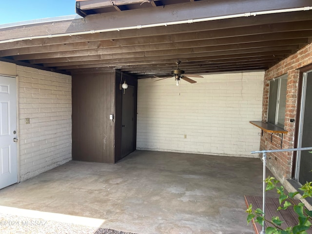 exterior space featuring ceiling fan and a carport