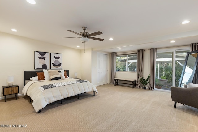 carpeted bedroom featuring a closet and ceiling fan