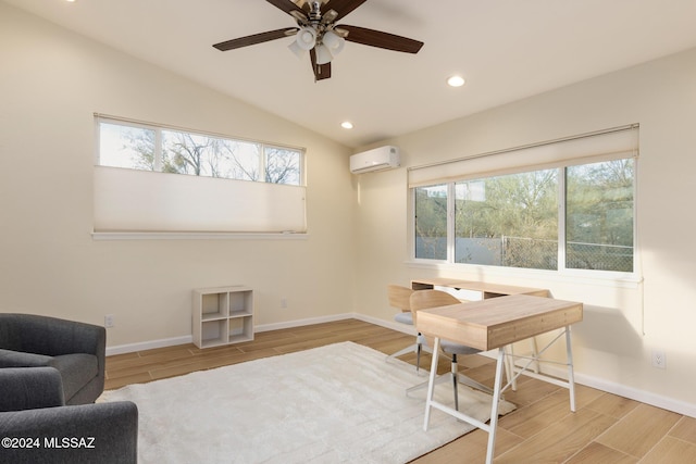 office space with plenty of natural light, ceiling fan, and light wood-type flooring