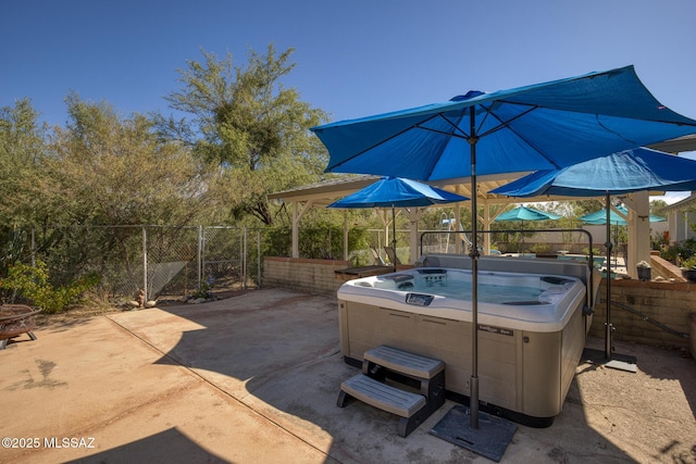 view of patio with a hot tub