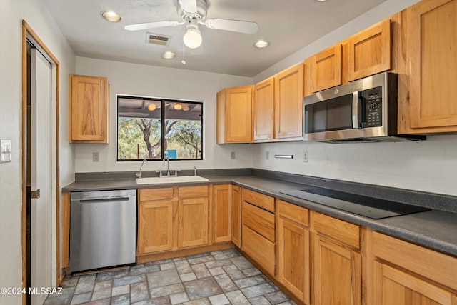 kitchen featuring ceiling fan, sink, and appliances with stainless steel finishes