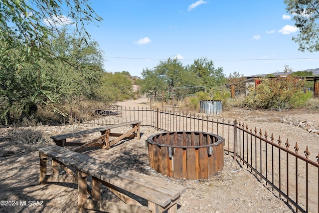 view of yard with an outdoor fire pit