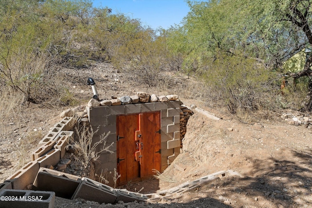 view of entry to storm shelter