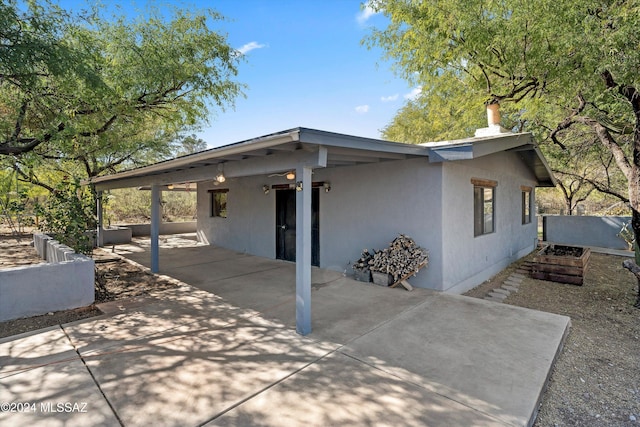 view of side of home featuring a patio area