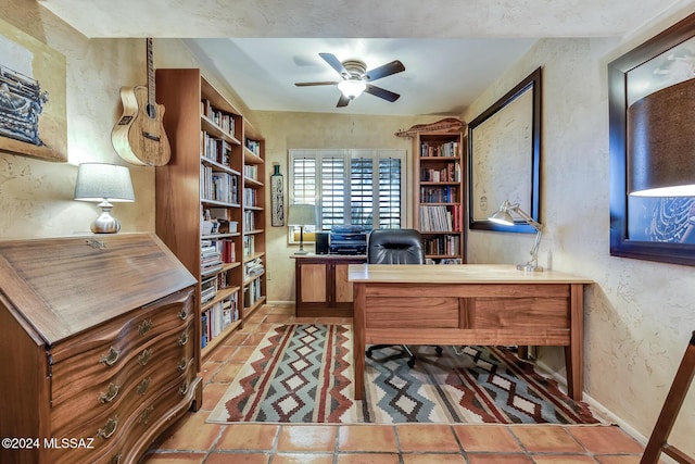 office area featuring tile patterned floors and ceiling fan