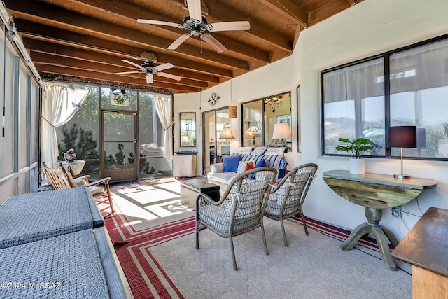 sunroom featuring wood ceiling and beamed ceiling