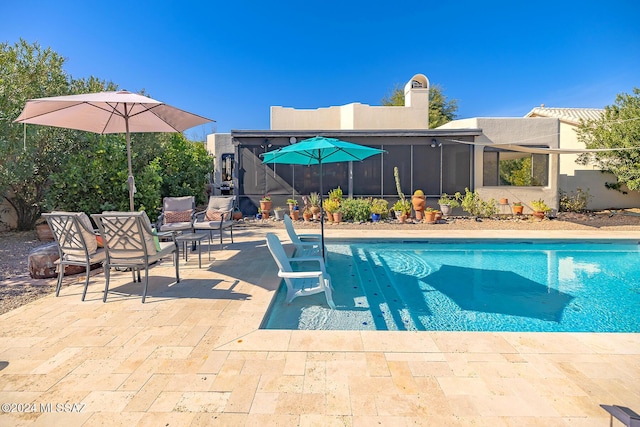 view of swimming pool with a patio area