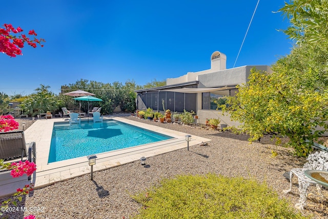 view of swimming pool with a patio