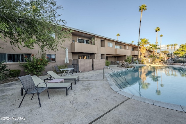 view of swimming pool with a patio area