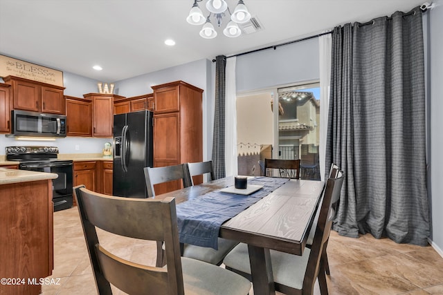 tiled dining space featuring a notable chandelier