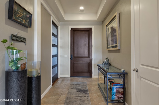 interior space featuring a tray ceiling