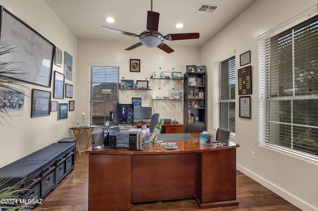 office space featuring dark hardwood / wood-style flooring and ceiling fan