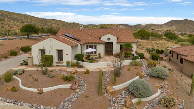 view of front of property with a mountain view