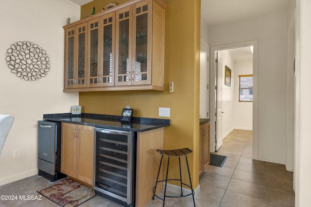 bar featuring light tile patterned floors and wine cooler